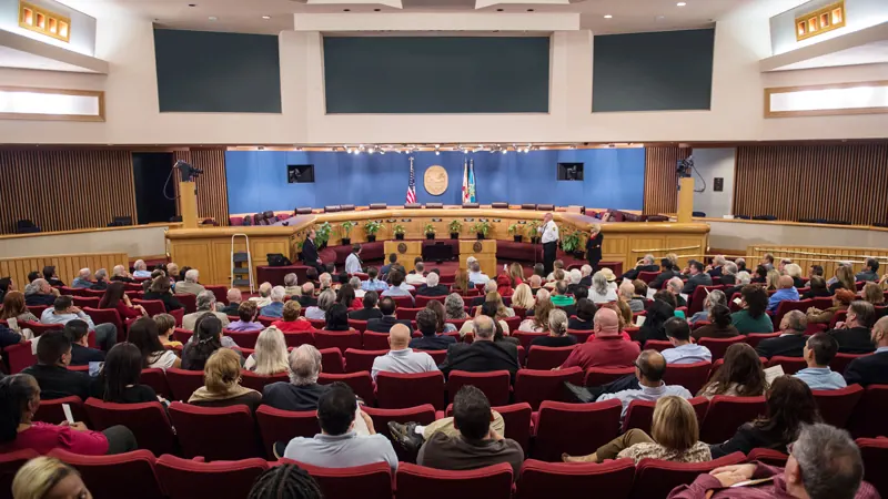 Residents filling the Miami-Dade commission chambers