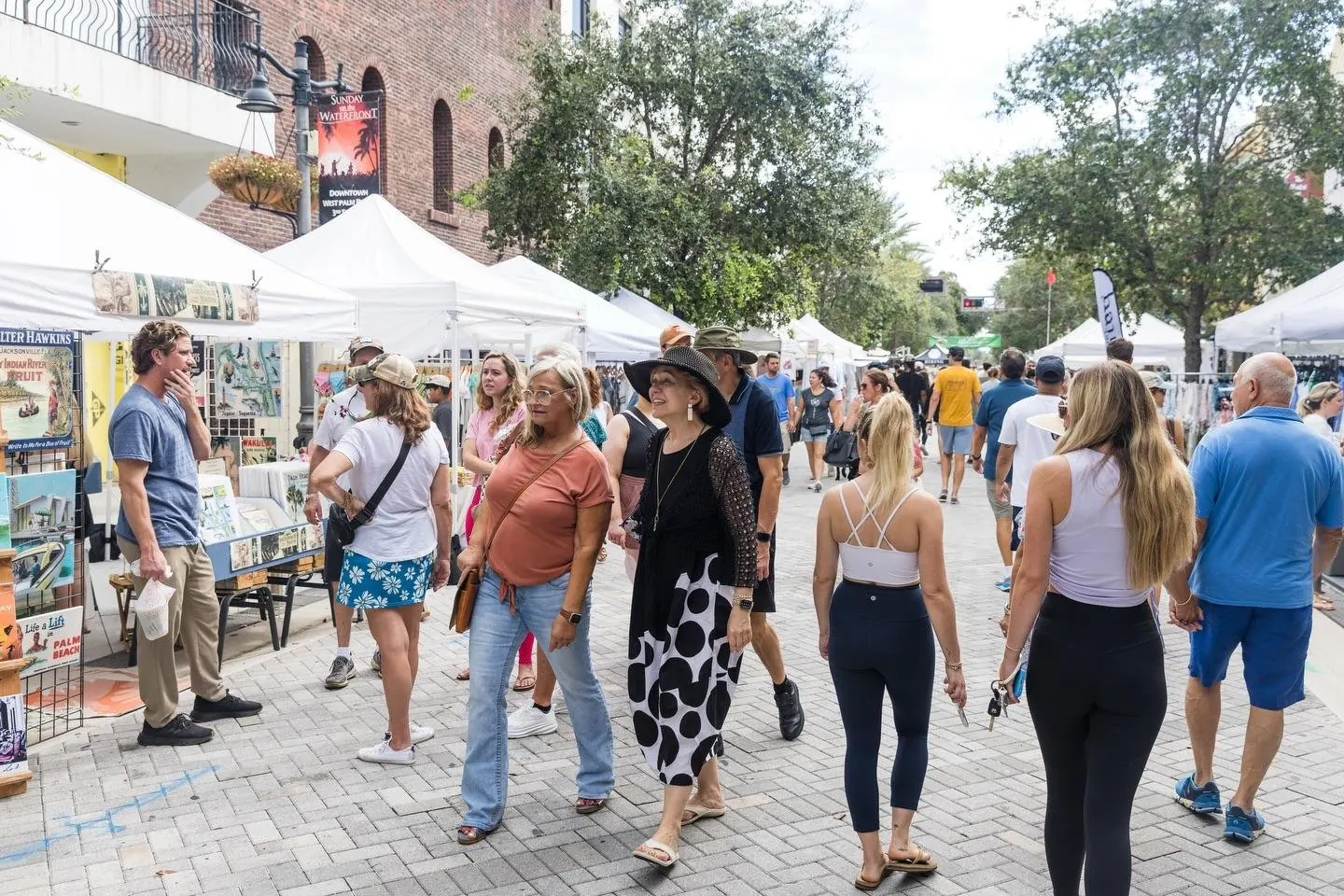 Neighbors at the Sunday waterfront market in West Palm Beach